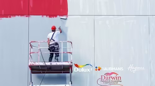 Darwin Painters & Decorating Contractors NT images/Colorful modern apartment exterior in Palmerston painted by Darwin Painters  Decorating Contractors NT featuring vibrant red accents and professional NT building located palmerston city painting workmanship.
